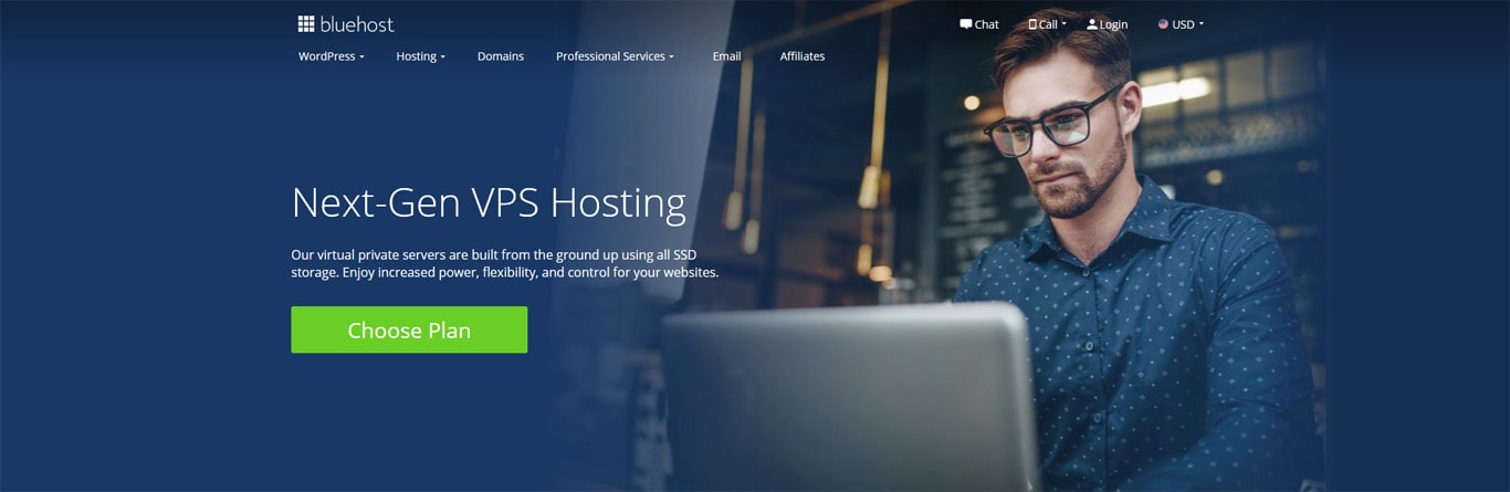 Bluehost's virtual private server page with a man holding a laptop